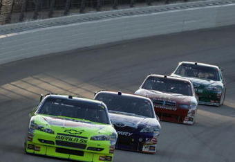 JOLIET, IL - JULY 11: Mark Martin, driving the #5 CARQUEST/Kellogg's Chevrolet, leads a group of cars during the NASCAR Sprint Cup Series LifeLock.com 400 at Chicagoland Speedway on July 11, 2009 in Joliet, Illinois.  (Photo by Jonathan Daniel/Getty Images)