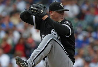 CHICAGO - JUNE 17: Bobby Jenks #45 of the Chicago White Sox pitches in the ninth inning against the Chicago Cubs on his way to a save on June 17, 2009 at Wrigley Field in Chicago, Illinois. The White Sox defeated the Cubs 4-1. (Photo by Jonathan Daniel/Getty Images)