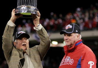 PHILADELPHIA - OCTOBER 29:  (L-R) General Manager Pat Gillick and manager Charlie Manuel #41 of of the Philadelphia Phillies celebrate with the World Series trophy after their 4-3 win against the Tampa Bay Rays during the continuation of game five of the 2008 MLB World Series on October 29, 2008 at Citizens Bank Park in Philadelphia, Pennsylvania.  (Photo by Doug Pensinger/Getty Images)