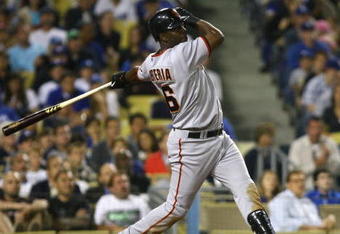 LOS ANGELES, CA - MAY 08:  Edgar Renteria #16 of the San Francisco Giants hits a sacrafice fly scoring Juan Uribe in the seventh inning against the Los Angeles Dodgers at Dodger Stadium on May 8, 2009 in Los Angeles, California.  (Photo by Jeff Gross/Getty Images)