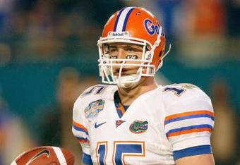 MIAMI - JANUARY 08:  Quarterback Tim Tebow #15 of the Florida Gators looks to the sidelines against the Oklahoma Sooners during the FedEx BCS National Championship Game at Dolphin Stadium on January 8, 2009 in Miami, Florida.  (Photo by Eliot J. Schechter/Getty Images)