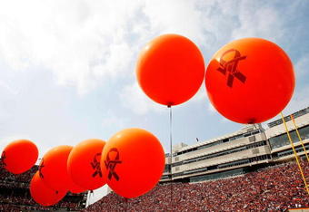 BLACKSBURG, VA - SEPTEMBER 01:  Members of the Virginia Tech cheerleading squad and pep squad hold balloons representing the 32 victims of the shooting at the school, before the start of the season opener September 1, 2007 at Lane Stadium in Blacksburg, Virginia. In addition to honoring the 32 students and faculty killed in the nation's deadliest shooting rampage before the game, the university also honored victims' families, those wounded and first responders to the massacre at Norris Hall.  (Photo by Win McNamee/Getty Images)