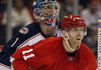 DETROIT, MI - MARCH 7:  Steve Mason #1 of the Columbus Blue Jackets is screened by Daniel Cleary #11 of the Detroit Red Wings in a game on March 7, 2009 at the Joe Louis Arena in Detroit, Michigan. The Blue Jackets defeated the Red Wings 8-2 on the strength of a hat trick by Rick Nash. (Photo by Claus Andersen/Getty Images)
