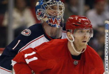 DETROIT, MI - MARCH 7:  Steve Mason #1 of the Columbus Blue Jackets is screened by Daniel Cleary #11 of the Detroit Red Wings in a game on March 7, 2009 at the Joe Louis Arena in Detroit, Michigan. The Blue Jackets defeated the Red Wings 8-2 on the strength of a hat trick by Rick Nash. (Photo by Claus Andersen/Getty Images)