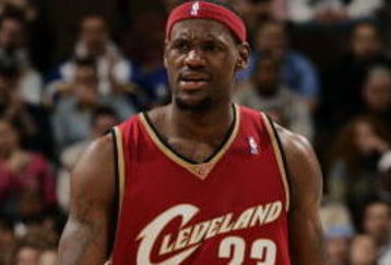 DENVER - JANUARY 18:  LeBron James #23 of the Cleveland Cavaliers appears annoyed after getting called for an offensive foul on Carmelo Anthony #15 of the Denver Nuggets in the first half on January 16, 2006 at the Pepsi Center in Denver, Colorado.  NOTE TO USER: USER expressly acknowledges and agrees that, by downloading and or using this photograph, User is consenting to the terms and conditions of the Getty Images License Agreement. (Photo by Brian Bahr/Getty Images) 