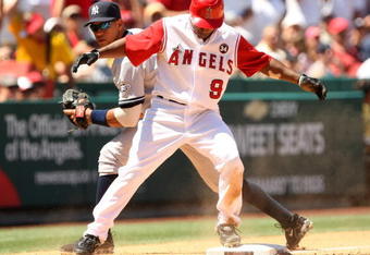 ANAHEIM, CA - JULY 12:  Chone Figgins #9 of the Los Angeles Angels of Anaheim is safe in front of third baseman Alex Rodriguez #13 of the New York Yankees with a triple, which set upt he Angels fifth run, in the seventh inning on July 12, 2009 at Angel Stadium in Anaheim, California.  The Angels won 5-4.  (Photo by Stephen Dunn/Getty Images)
