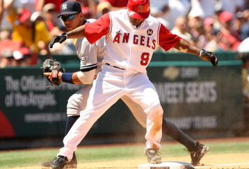 ANAHEIM, CA - JULY 12:  Chone Figgins #9 of the Los Angeles Angels of Anaheim is safe in front of third baseman Alex Rodriguez #13 of the New York Yankees with a triple, which set upt he Angels fifth run, in the seventh inning on July 12, 2009 at Angel Stadium in Anaheim, California.  The Angels won 5-4.  (Photo by Stephen Dunn/Getty Images)
