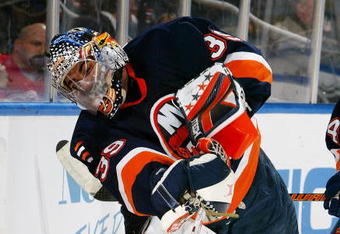 UNIONDALE, NY - JANUARY 30:  Rick DiPetro #39 of the New York Islanders clears the puck against the Detroit Red Wings on January 30, 2007 at Nassau Coliseum in Uniondale, New York.  (Photo by Jim McIsaac/Getty Images)
