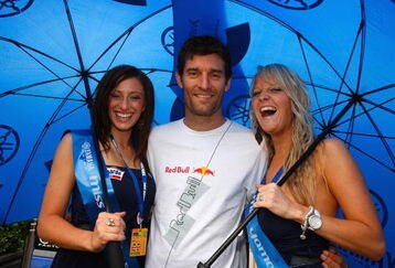 DONNINGTON, ENGLAND - JUNE 28:  Red Bull racing Formula 1 driver Mark Webber of Australia with Yamaha grid girls at the Castle Donnington race track on June 28, 2009 in Donnington, England.  (Photo by Mark Thompson/Getty Images)