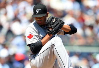 NEW YORK - JULY 06:  Ricky Romero #24 of the Toronto Blue Jays pitches against the New York Yankees on July 6, 2009 at Yankee Stadium in the Bronx borough of New York City.  (Photo by Jim McIsaac/Getty Images)