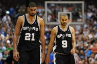DALLAS - APRIL 25:  Forward Tim Duncan #21 and Tony Parker #9 of the San Antonio Spurs during a 99-90 loss against the Dallas Mavericks in Game Four of the Western Conference Quarterfinals during the 2009 NBA Playoffs at American Airlines Center on April 25, 2009 in Dallas, Texas. NOTE TO USER: User expressly acknowledges and agrees that, by downloading and or using this photograph, User is consenting to the terms and conditions of the Getty Images License Agreement.  (Photo by Ronald Martinez/Getty Images)