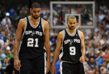 DALLAS - APRIL 25:  Forward Tim Duncan #21 and Tony Parker #9 of the San Antonio Spurs during a 99-90 loss against the Dallas Mavericks in Game Four of the Western Conference Quarterfinals during the 2009 NBA Playoffs at American Airlines Center on April 25, 2009 in Dallas, Texas. NOTE TO USER: User expressly acknowledges and agrees that, by downloading and or using this photograph, User is consenting to the terms and conditions of the Getty Images License Agreement.  (Photo by Ronald Martinez/Getty Images)