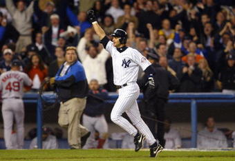 BRONX, NY - OCTOBER 16:  Aaron Boone #19 of the New York Yankees celebrates after hitting the game winning home run in the bottom of the eleventh inning against the Boston Red Sox during game 7 of the American League Championship Series on October 16, 2003 at Yankee Stadium in the Bronx, New York. The Yankees won 6-5, advancing them to the World Series.  (Photo by Ezra Shaw/Getty Images)