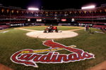 ST. LOUIS - OCTOBER 19:  A lawn mower is shown on home plate with a tarp as fans leave the stands following the St. Louis Cardinals 5-1 loss the Houston Astros during Game Six of the National League Championship Series October 19, 2005 at Busch Stadium in St. Louis, Missouri. With the win the Astros won the series 4-2 and advanced to the World Series. The game was the last to be played in the 40 year history of Busch Stadium. A new Busch Stadium (under construction) will be the new home of the Cardinals starting with the opening of the 2006 MLB regular season.  (Photo by Ronald Martinez/Getty Images)