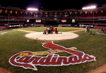 ST. LOUIS - OCTOBER 19:  A lawn mower is shown on home plate with a tarp as fans leave the stands following the St. Louis Cardinals 5-1 loss the Houston Astros during Game Six of the National League Championship Series October 19, 2005 at Busch Stadium in St. Louis, Missouri. With the win the Astros won the series 4-2 and advanced to the World Series. The game was the last to be played in the 40 year history of Busch Stadium. A new Busch Stadium (under construction) will be the new home of the Cardinals starting with the opening of the 2006 MLB regular season.  (Photo by Ronald Martinez/Getty Images)