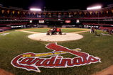 ST. LOUIS - OCTOBER 19:  A lawn mower is shown on home plate with a tarp as fans leave the stands following the St. Louis Cardinals 5-1 loss the Houston Astros during Game Six of the National League Championship Series October 19, 2005 at Busch Stadium in St. Louis, Missouri. With the win the Astros won the series 4-2 and advanced to the World Series. The game was the last to be played in the 40 year history of Busch Stadium. A new Busch Stadium (under construction) will be the new home of the Cardinals starting with the opening of the 2006 MLB regular season.  (Photo by Ronald Martinez/Getty Images)