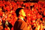 HOUSTON - APRIL 19: Injured center Yao Ming #11 of the Houston Rockets is lit by pyrotechniques as he watches pregame introductions for Game One of the Western Conference Quarterfinals against the Utah Jazz during the 2008 NBA Playoffs at the Toyota Center on April 19, 2008 in Houston, Texas. The Jazz won 93-82.  NOTE TO USER: User expressly acknowledges and agrees that, by downloading and or using this photograph, User is consenting to the terms and conditions of the Getty Images License Agreement. (Photo by Stephen Dunn/Getty Images)