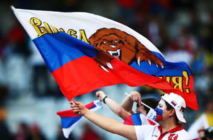 INNSBRUCK, AUSTRIA - JUNE 18:  A Russia fan waves a flag ahead of the UEFA EURO 2008 Group D match between Russia and Sweden at Stadion Tivoli Neu on June 18, 2008 in Innsbruck, Austria.  (Photo by Richard Heathcote/Getty Images)