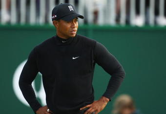 TURNBERRY, SCOTLAND - JULY 17:  Tiger Woods of USA leaves the 18th green during round two of the 138th Open Championship on the Ailsa Course, Turnberry Golf Club on July 17, 2009 in Turnberry, Scotland.  (Photo by Richard Heathcote/Getty Images)