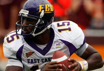 BLACKSBURG, VA - SEPTEMBER 01:  Quarterback Patrick Pinkney of the East Carolina Pirates rolls out of the pocket to pass in the third quarter against the Virginia Tech Hokies on September 1, 2007 at Lane Stadium in Blacksburg, Virginia. Virginia Tech won the game 17-7.  (Photo by Win McNamee/Getty Images)