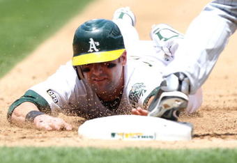 OAKLAND, CA - JUNE 11:  Adam Kennedy #29 of the Oakland Athletics is doubled off first base on a ball hit by Matt Holliday in the fourth inning against the Minnesota Twins during a Major League Baseball game on June 11, 2009 at the Oakland Coliseum in Oakland, California.  (Photo by Jed Jacobsohn/Getty Images)