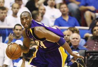 ORLANDO, FL - JUNE 14:  Kobe Bryant #24 of the Los Angeles Lakers moves the ball against the Orlando Magic in Game Five of the 2009 NBA Finals on June 14, 2009 at Amway Arena in Orlando, Florida. The Lakers won 99-86.  NOTE TO USER:  User expressly acknowledges and agrees that, by downloading and or using this photograph, User is consenting to the terms and conditions of the Getty Images License Agreement. (Photo by Ronald Martinez/Getty Images) 