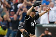 CHICAGO, IL - JULY 23: Pitcher Mark Buehrle #56 of the Chicago White Sox celebrates after pitching a perfect game as he is grabbed by first baseman Josh Fields #7 against the Tampa Bay Rays at U.S. Cellular Field on July 23, 2009 in Chicago, Illinois. The The White Sox defeated the Rays 5-0. (Photo by Scott Boehm/Getty Images)