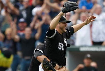 CHICAGO, IL - JULY 23: Pitcher Mark Buehrle #56 of the Chicago White Sox celebrates after pitching a perfect game as he is grabbed by first baseman Josh Fields #7 against the Tampa Bay Rays at U.S. Cellular Field on July 23, 2009 in Chicago, Illinois. The The White Sox defeated the Rays 5-0. (Photo by Scott Boehm/Getty Images)