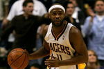 INDIANAPOLIS - NOVEMBER 23:  Jamaal Tinsley #11 of the Indiana Pacers brings the ball down court against the Dallas Mavericks at Conseco Fieldhouse November 23, 2007 in Indianapolis, Indiana.  (Photo by Matthew Stockman/Getty Images)