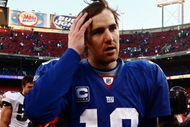 EAST RUTHERFORD, NJ - JANUARY 11:  Eli Manning #10 of the New York Giants walks off the field after losing to the Philadelphia Eagles during the NFC Divisional Playoff Game on January 11, 2009 at Giants Stadium in East Rutherford, New Jersey.The Eagles won the game by a score of 23-11.  (Photo by Chris McGrath/Getty Images)