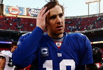 EAST RUTHERFORD, NJ - JANUARY 11: Eli Manning #10 of the New York Giants walks off the field after losing to the Philadelphia Eagles during the NFC Divisional Playoff Game on January 11, 2009 at Giants Stadium in East Rutherford, New Jersey.The Eagles won the game by a score of 23-11. (Photo by Chris McGrath/Getty Images)