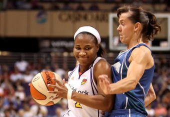PHOENIX - JULY 22:  Temeka Johnson #2 of the Phoenix Mercury drives against Kelly Miller #2 of the Minnesota Lynx during the WNBA game at US Airways Center on July 22, 2009 in Phoenix, Arizona. The Lynx defeated the Mercury 99-86. NOTE TO USER: User expressly acknowledges and agrees that, by downloading and or using this photograph, User is consenting to the terms and conditions of the Getty Images License Agreement.  (Photo by Christian Petersen/Getty Images)