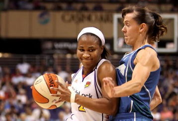 PHOENIX - JULY 22:  Temeka Johnson #2 of the Phoenix Mercury drives against Kelly Miller #2 of the Minnesota Lynx during the WNBA game at US Airways Center on July 22, 2009 in Phoenix, Arizona. The Lynx defeated the Mercury 99-86. NOTE TO USER: User expressly acknowledges and agrees that, by downloading and or using this photograph, User is consenting to the terms and conditions of the Getty Images License Agreement.  (Photo by Christian Petersen/Getty Images)