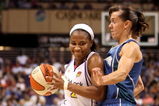 PHOENIX - JULY 22:  Temeka Johnson #2 of the Phoenix Mercury drives against Kelly Miller #2 of the Minnesota Lynx during the WNBA game at US Airways Center on July 22, 2009 in Phoenix, Arizona. The Lynx defeated the Mercury 99-86. NOTE TO USER: User expressly acknowledges and agrees that, by downloading and or using this photograph, User is consenting to the terms and conditions of the Getty Images License Agreement.  (Photo by Christian Petersen/Getty Images)