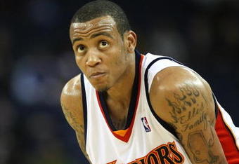 OAKLAND, CA - MARCH 30:  Monta Ellis #8 of the Golden State Warriors looks on against the Memphis Grizzlies during an NBA game on March 30, 2009 at Oracle Arena in Oakland, California. NOTE TO USER: User expressly acknowledges and agrees that, by downloading and or using this photograph, User is consenting to the terms and conditions of the Getty Images License Agreement.  (Photo by Jed Jacobsohn/Getty Images)