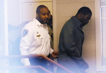 Sussex, VA - NOVEMBER 25:  Suspended Atlanta Falcons quarterback Michael Vick (R) leaves Surry County Circuit Court after entering a guilty plea on two felony counts connected to dog fighting on November 25, 2008 in Sussex, Virginia. Under a plea agreement, Vick, who is currently serving a term in prison for federal dog fighting charges, will serve one-year of probation for the state charges. He is scheduled to be released on July of 2009.  (Photo by Geoff Burke/Getty Images)