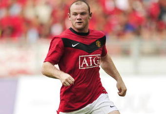KUALA LUMPUR, MALAYSIA - JULY 18: Wayne Rooney of Manchester United runs for the ball during the pre-season friendly match between Manchester United and Malaysia XI at the Bukit Jalil National Stadium on July 18, 2009 in Kuala Lumpur, Malaysia. (Photo by Stanley Chou/Getty Images)