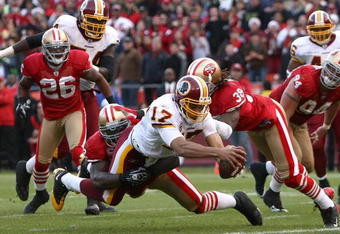 SAN FRANCISCO - DECEMBER 28:  Quarterback Jason Campbell #17 of the Washington Redskins stretches the ball across the goal line to score a tying touchdown in the fourth quarter as Patrick Willis #52 of the San Francisco 49ers attempts to tackle him at Candlestick Park on December 28, 2008 in San Francisco, California  (Photo by Jonathan Ferrey/Getty Images)