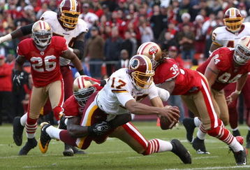 SAN FRANCISCO - DECEMBER 28:  Quarterback Jason Campbell #17 of the Washington Redskins stretches the ball across the goal line to score a tying touchdown in the fourth quarter as Patrick Willis #52 of the San Francisco 49ers attempts to tackle him at Candlestick Park on December 28, 2008 in San Francisco, California  (Photo by Jonathan Ferrey/Getty Images)