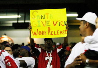 ATLANTA - DECEMBER 10:  A man holds up a sign in support of Michael Vick of the Atlanta Falcons during the game against the New Orleans Saints on December 10, 2007 at the Georgia Dome in Atlanta, Georgia.  The Saints defeated the Falcons 34-14.  (Photo by Chris Graythen/Getty Images)