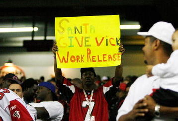 ATLANTA - DECEMBER 10:  A man holds up a sign in support of Michael Vick of the Atlanta Falcons during the game against the New Orleans Saints on December 10, 2007 at the Georgia Dome in Atlanta, Georgia.  The Saints defeated the Falcons 34-14.  (Photo by Chris Graythen/Getty Images)