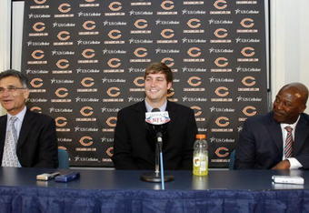 LAKE FOREST, IL - APRIL 3: General Manager Jerry Angelo (L) of the Chicago Bears looks on along with head coach Lovie Smith (R) as they introduce Jay Cutler as their new quarterback during a press conference on April 3, 2009 at Halas Hall in Lake Forest, Illinois. (Photo by Jim Prisching/Getty Images)