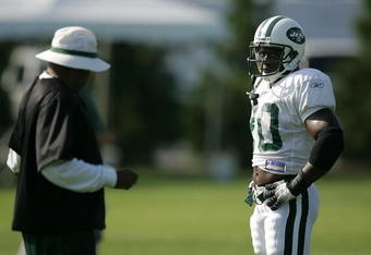 FARMINGDALE, NY - JULY 27:  JULY 27:  Running back Thomas Jones #20 of the New York Jets talks with coach Jimmy Raye during the first day of training camp on July 27, 2007 at Hofstra University in Farmingdale, New York.  (Photo by Mike Ehrmann/Getty Images)