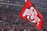 COLUMBUS, OH - NOVEMBER 18:  Ohio State Buckeyes mascot Brutus Buckeye waves a giant flag during the game against the Michigan Wolverines on November 18, 2006 at Ohio Stadium in Columbus, Ohio.  Ohio State won 42-39.  (Photo by Gregory Shamus/Getty Images)