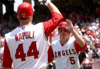 ANAHEIM, CA - MAY 14: Jeff Mathis #5 of the Los Angeles Angels of Anaheim celebrates with Mike Napoli #44 after scoring a run in third inning against the Boston Red Sox on May 14, 2009 at Angel Stadium in Anaheim, California.  The Angels won 5-4 in 12 innings.   (Photo by Stephen Dunn/Getty Images)