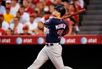 ANAHEIM, CA - JULY 23:  Justin Morneau  #7 of the Minnesota Twins flies out against the Los Angeles Angels of Anaheim during the baseball game on July 23, 2009 in Anaheim, California.  (Photo by Kevork Djansezian/Getty Images)