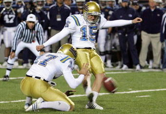 LAS VEGAS - DECEMBER 22:  UCLA Bruins punter Aaron Perez #17 holds the ball as Kai Forbath #15 attempts to kick a field goal with three seconds left in the fourth quarter of the Pioneer Las Vegas Bowl December 22, 2007 in Las Vegas, Nevada. The Cougars blocked the kick and won the game 17-16.  (Photo by Ethan Miller/Getty Images)  