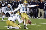 LAS VEGAS - DECEMBER 22:  UCLA Bruins punter Aaron Perez #17 holds the ball as Kai Forbath #15 attempts to kick a field goal with three seconds left in the fourth quarter of the Pioneer Las Vegas Bowl December 22, 2007 in Las Vegas, Nevada. The Cougars blocked the kick and won the game 17-16.  (Photo by Ethan Miller/Getty Images)  