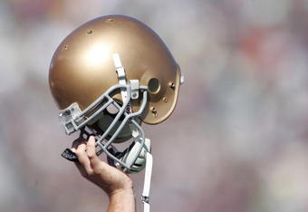 SOUTH BEND, IN - OCTOBER 07:  A member of Notre Dame Fighting Irish holds up his helmet on the opening kickoff during the game against the Stanford Cardinal on October 7, 2006 at Notre Dame Stadium in South Bend, Indiana.  (Photo by Andy Lyons/Getty Images)