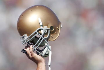 SOUTH BEND, IN - OCTOBER 07:  A member of Notre Dame Fighting Irish holds up his helmet on the opening kickoff during the game against the Stanford Cardinal on October 7, 2006 at Notre Dame Stadium in South Bend, Indiana.  (Photo by Andy Lyons/Getty Images)